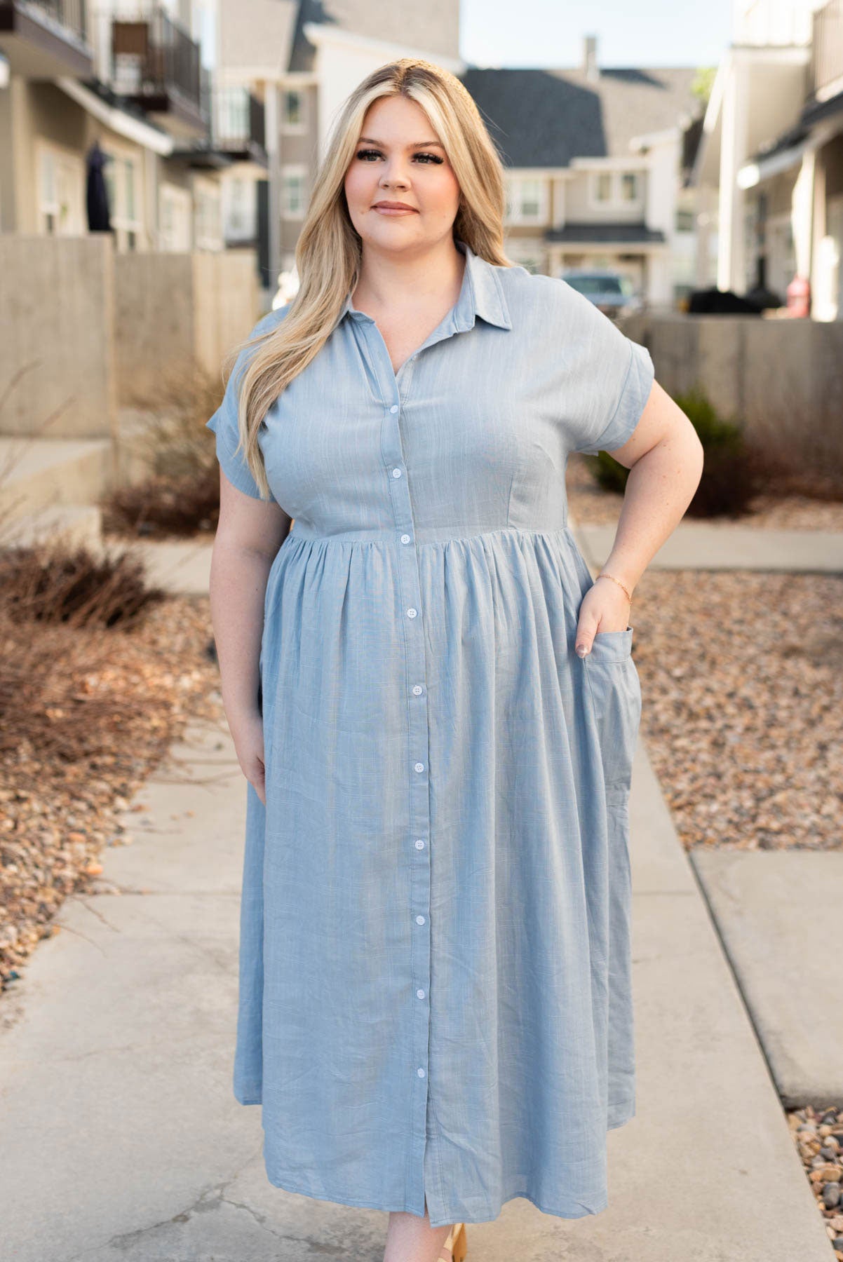 Plus size blue button down dress with short sleeves and collar