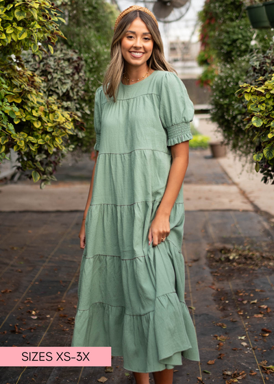 Tiered green dress with short puff sleeves