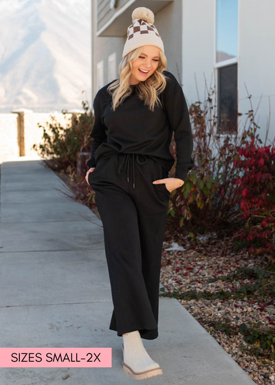 Long sleeve black textured lounge set with pockets and wide leg pants