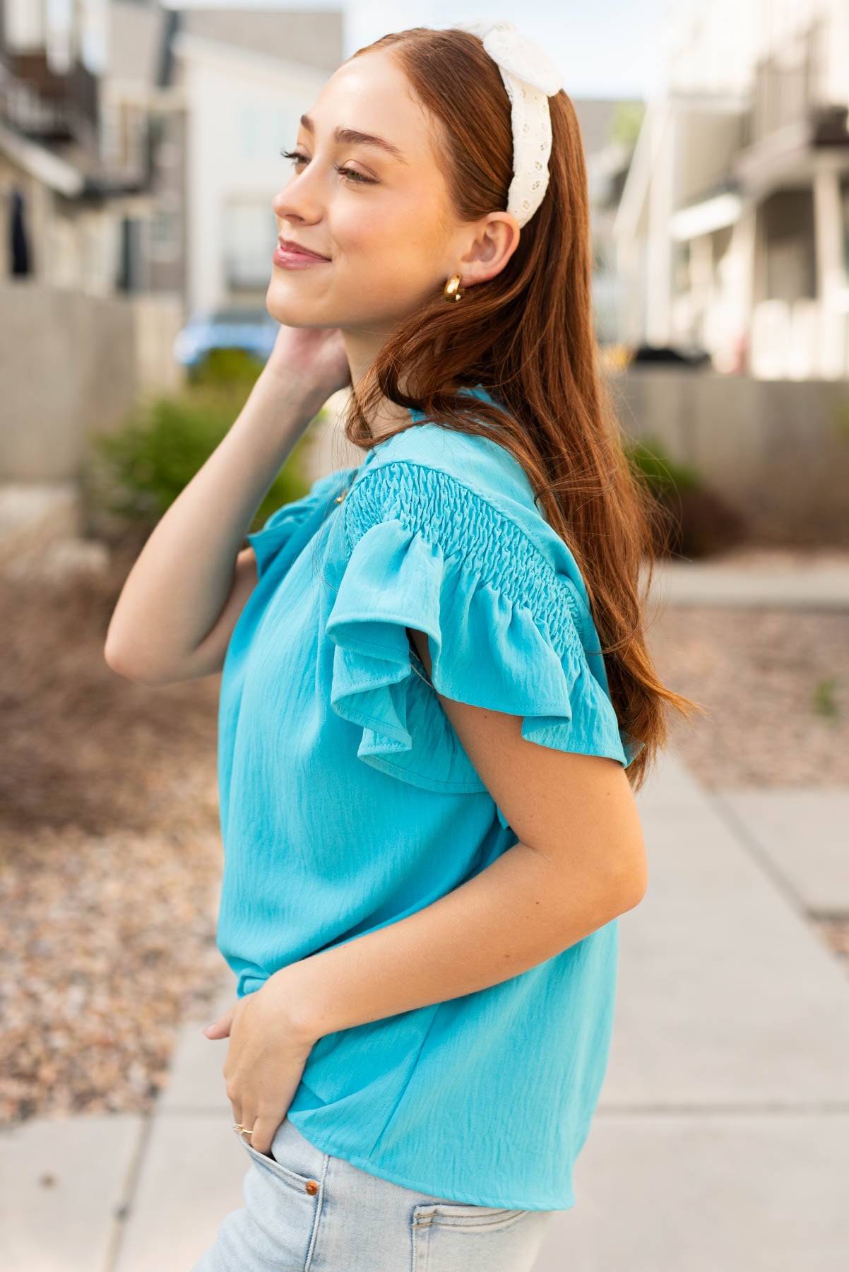 Side view of the turquoise ruffle blouse