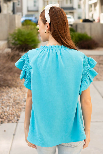 Back view of the turquoise ruffle blouse