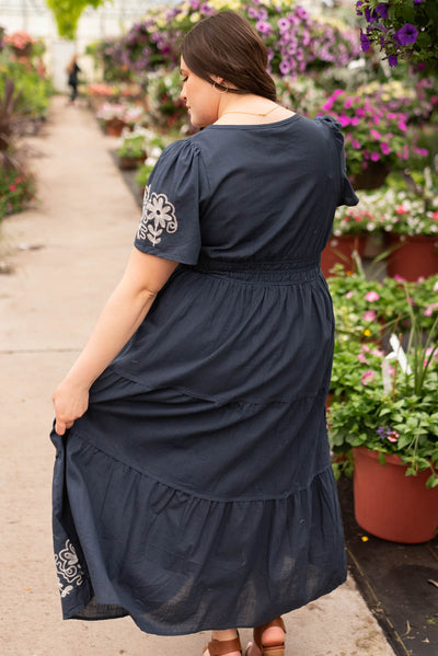 Back view of the plus size navy embroidered detail dress