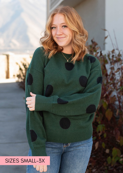 Long sleeve green poka dot sweater with black dots
