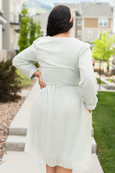 Back view of a sage green dress