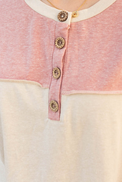 Mauve color block top with buttons at the neck
