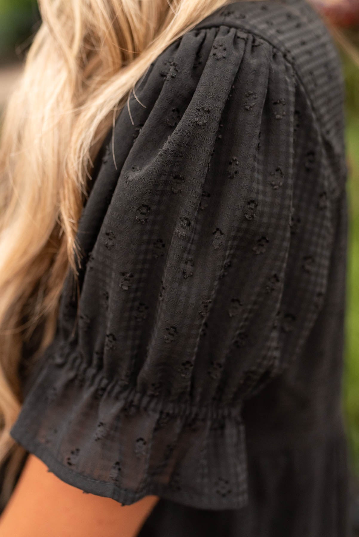 Close up of the sleeve on the black dot mid dress
