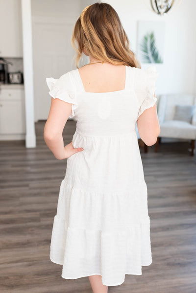 Back view of the white textured dress