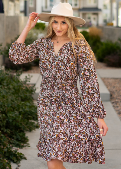 Brown floral dress with a v cut in the neckline