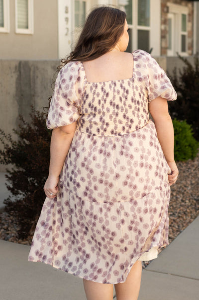 Back view of a plus size lavender dress with floral print