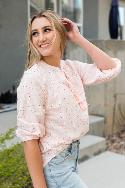 Side view of the pink floral woven blouse