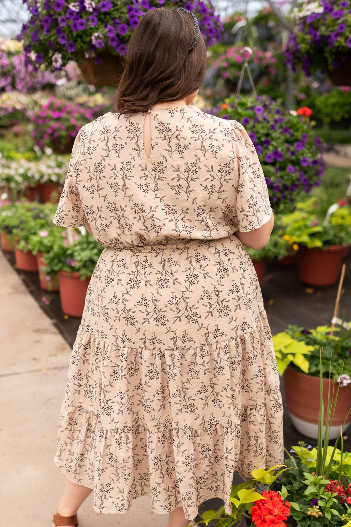 Back view of the taupe patterned dress in plus size