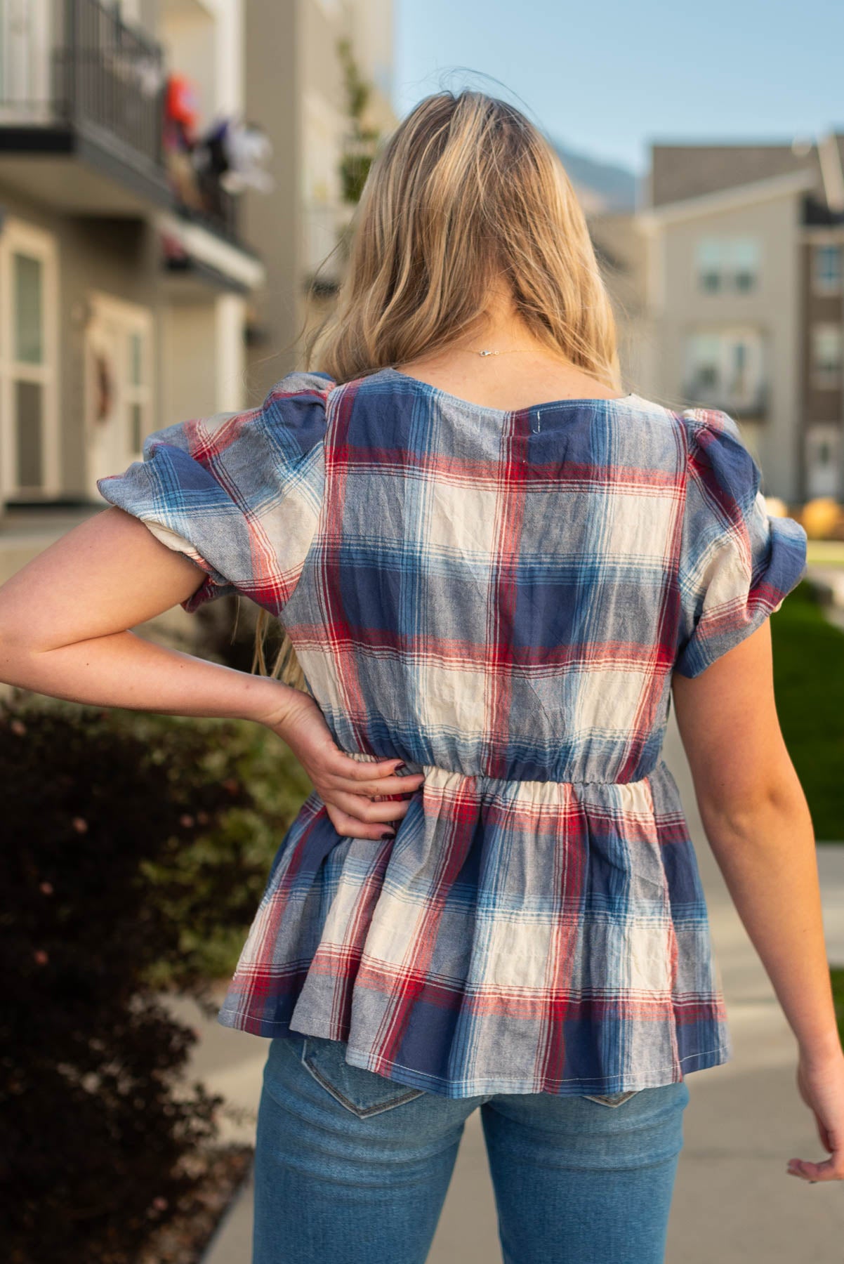 Back view of the navy plaid top