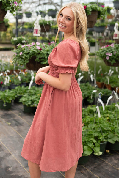 Side view of the dusty blush crocket smocked dress
