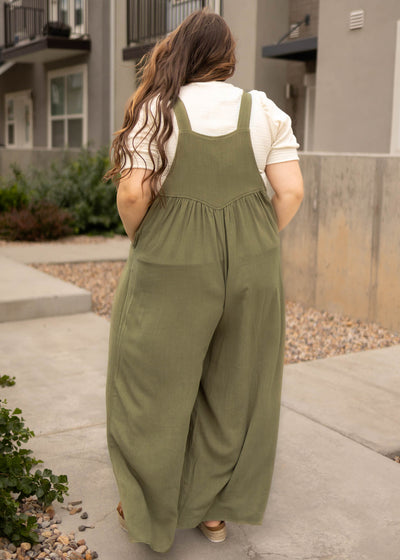 Back view of a plus size olive jumpsuit