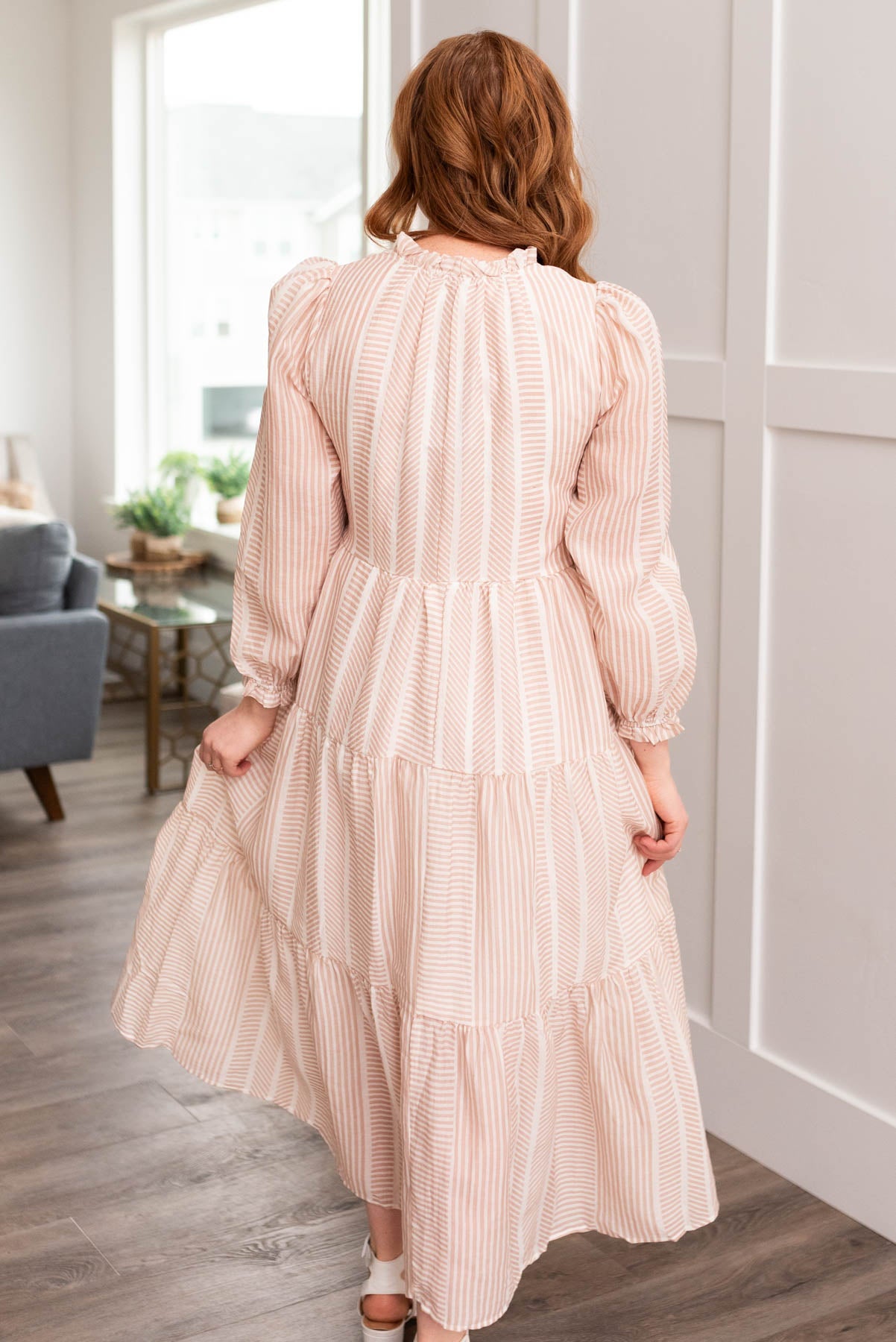 Back view of the tan patterned dress