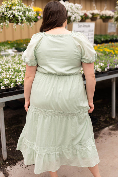 Back view of the sage eyelet tiered dress