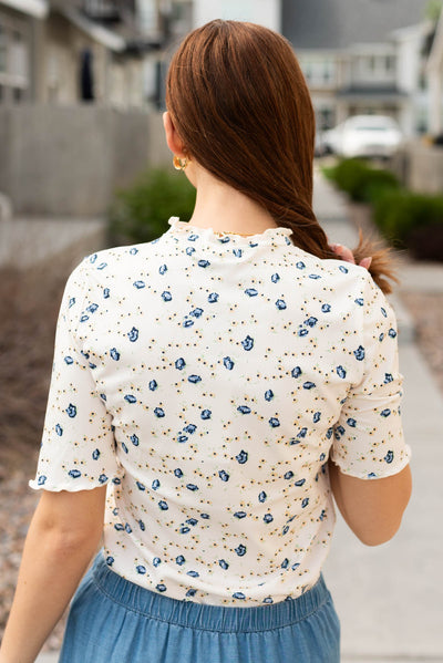 Back view of the cream floral top