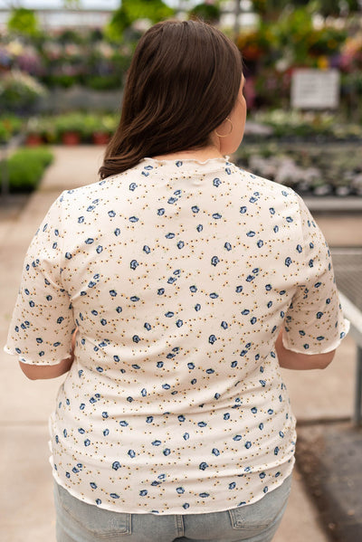 Back view of the plus size cream floral top