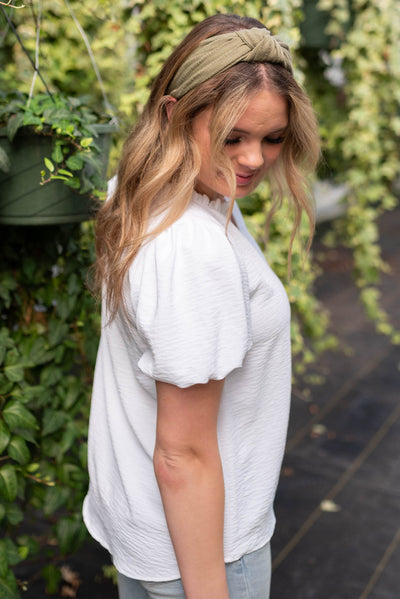 Side view of the white ruffle blouse