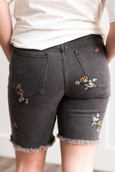 Back view of the black floral embroidered short