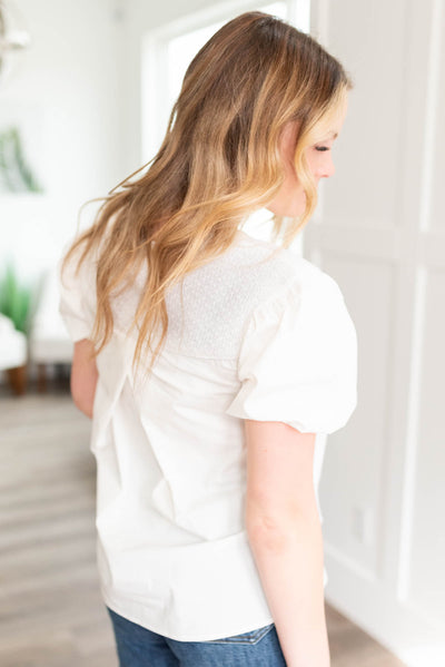 Side view of the off white blouse