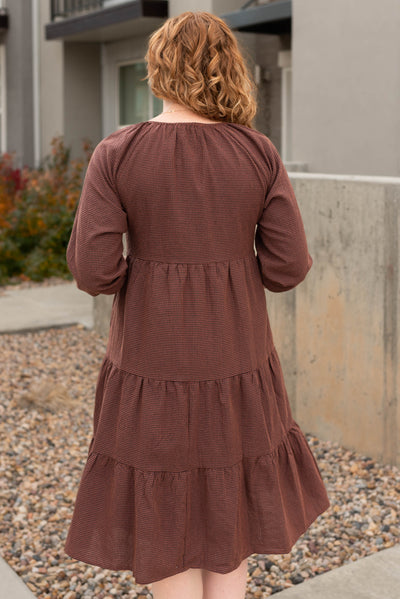 Back view of the rust tiered midi dress