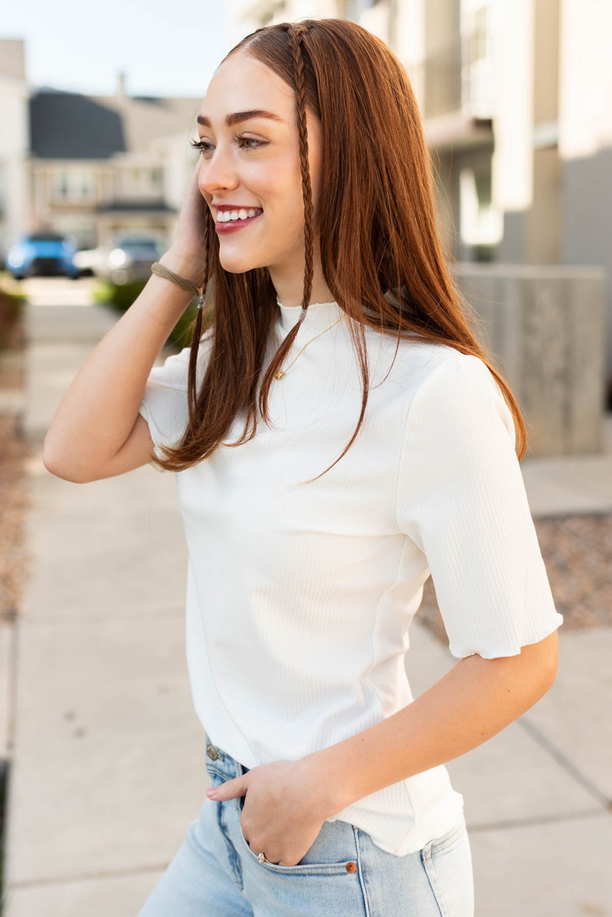 Side view of the ivory textured knit top