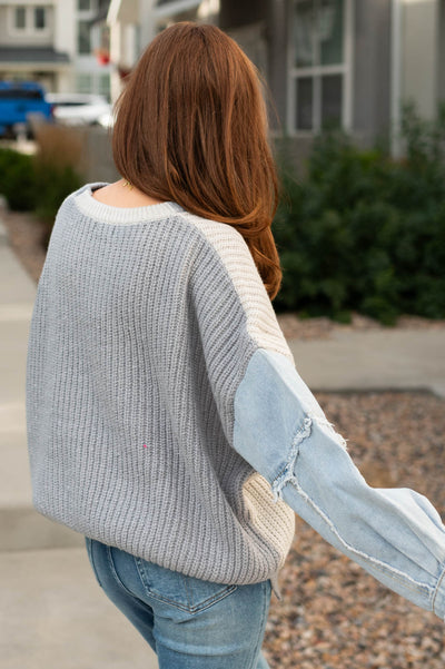 Back view of a grey sweater