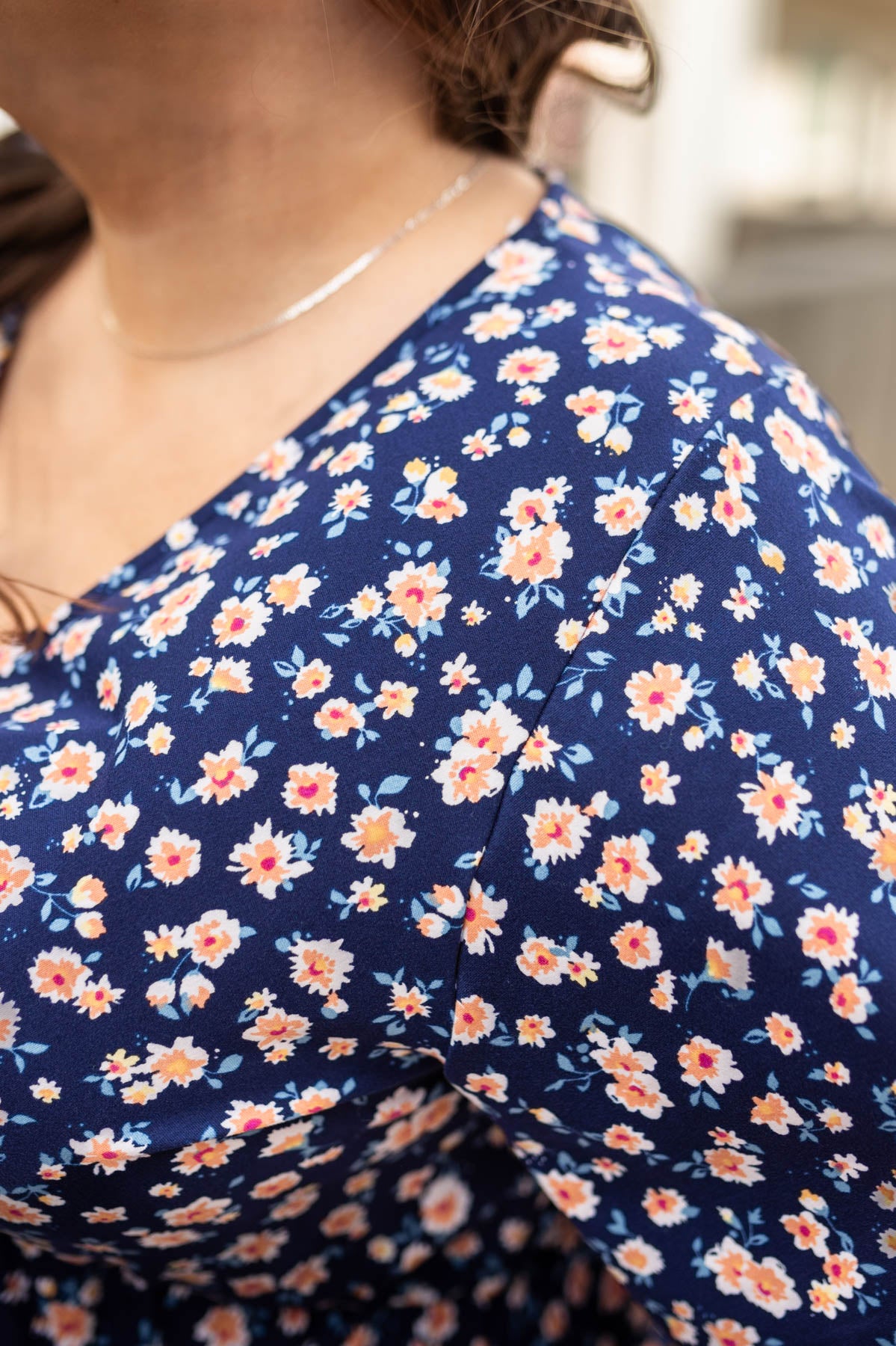 The print of a plus size navy floral dress