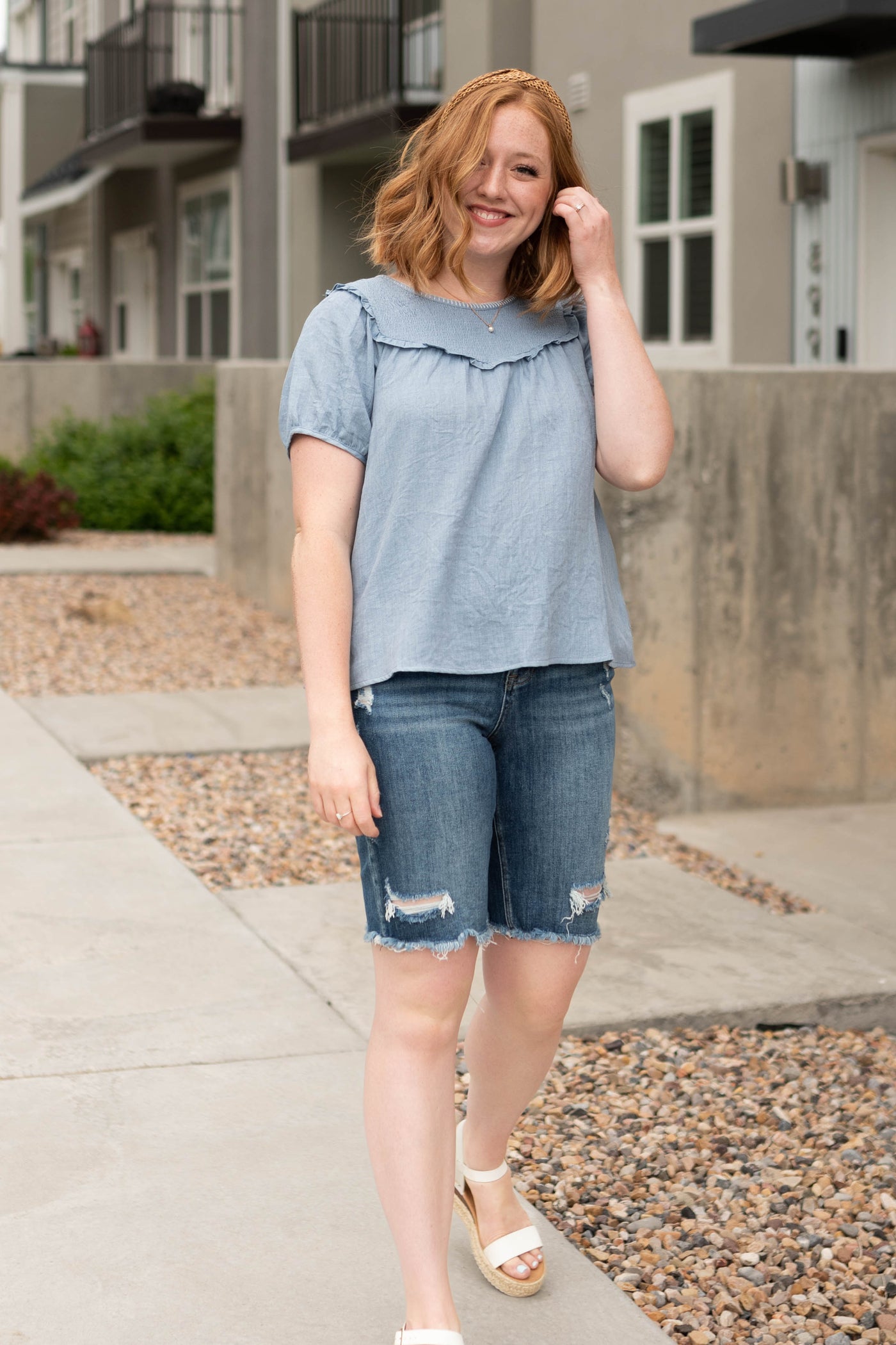 Short sleeve chambray top with smocking at the neck