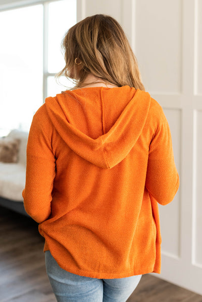 Back view of the apricot orange cardigan