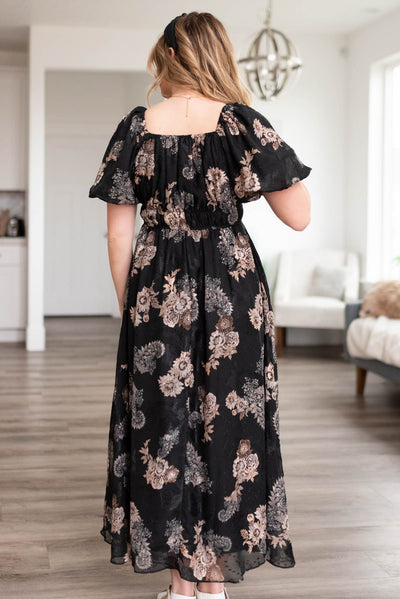 Back view of a black pattern dress