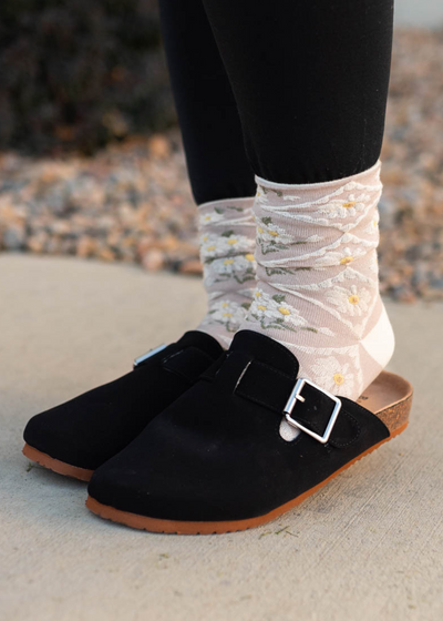 Side view of black clogs