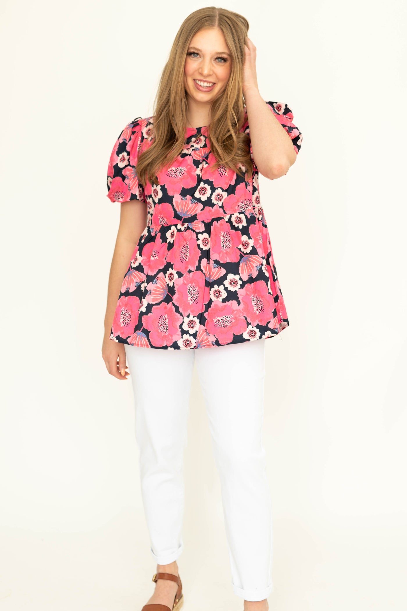 Front view of a short sleeve deep pink floral top.