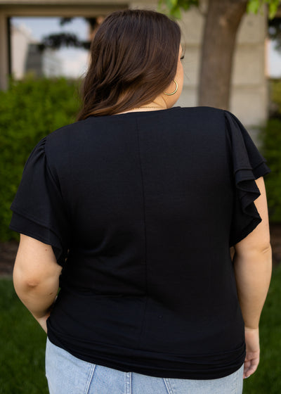 Back view of a black to that ties at the waist