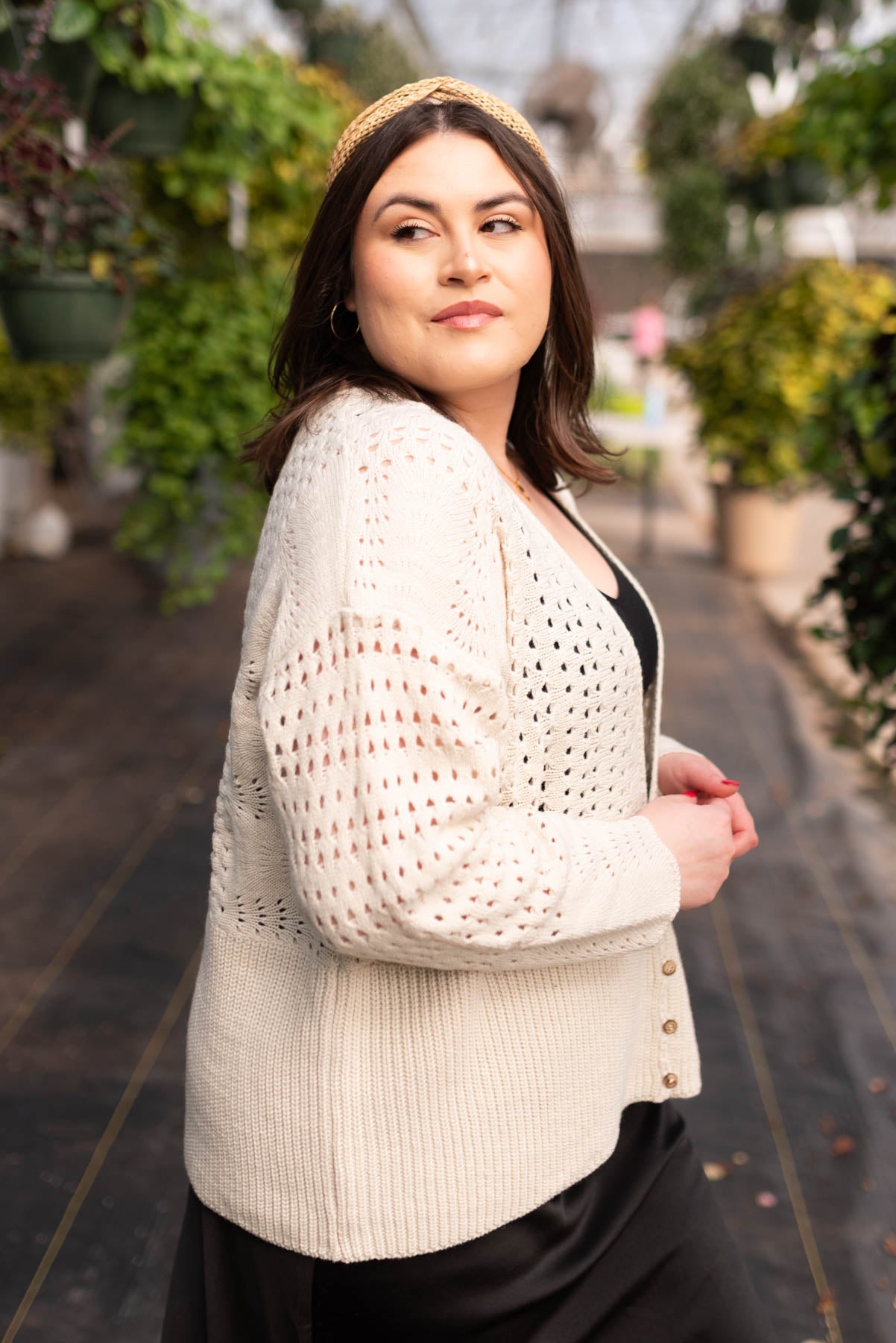 Side view of the plus size ivory knitted cardigan