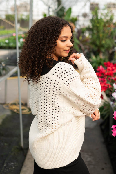 Side view of the ivory knitted cardigan