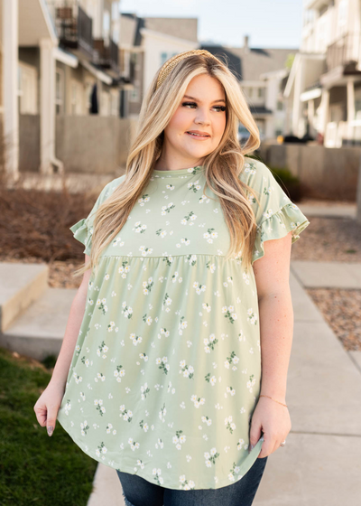 Plus size sage floral top with short sleeves and a ruffle