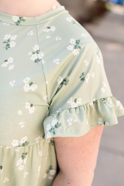 Close up of the fabric and sleeve on the plus size sage floral top