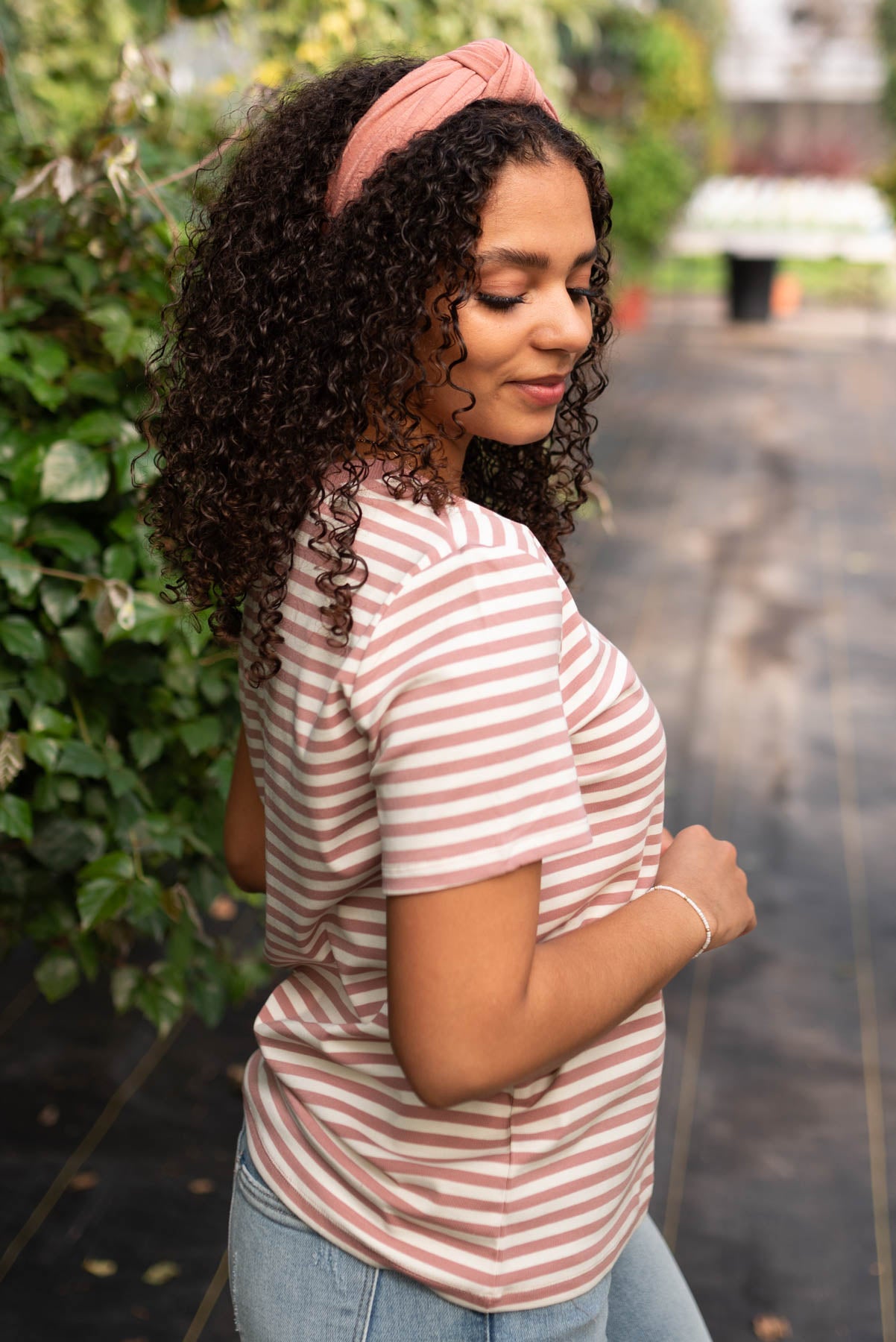 Side view of the blush stripe knit top