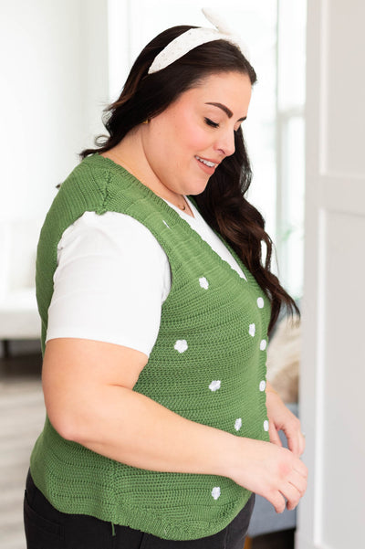 Side view of the plus size green knitted sweater