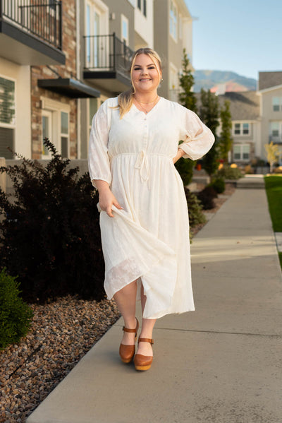 Plus size cream dress that ties at the waist