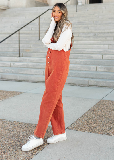 Side view of the rust jumpsuit