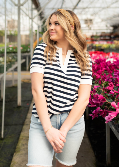 Navy stripe top with white trim on cuffs and the neck
