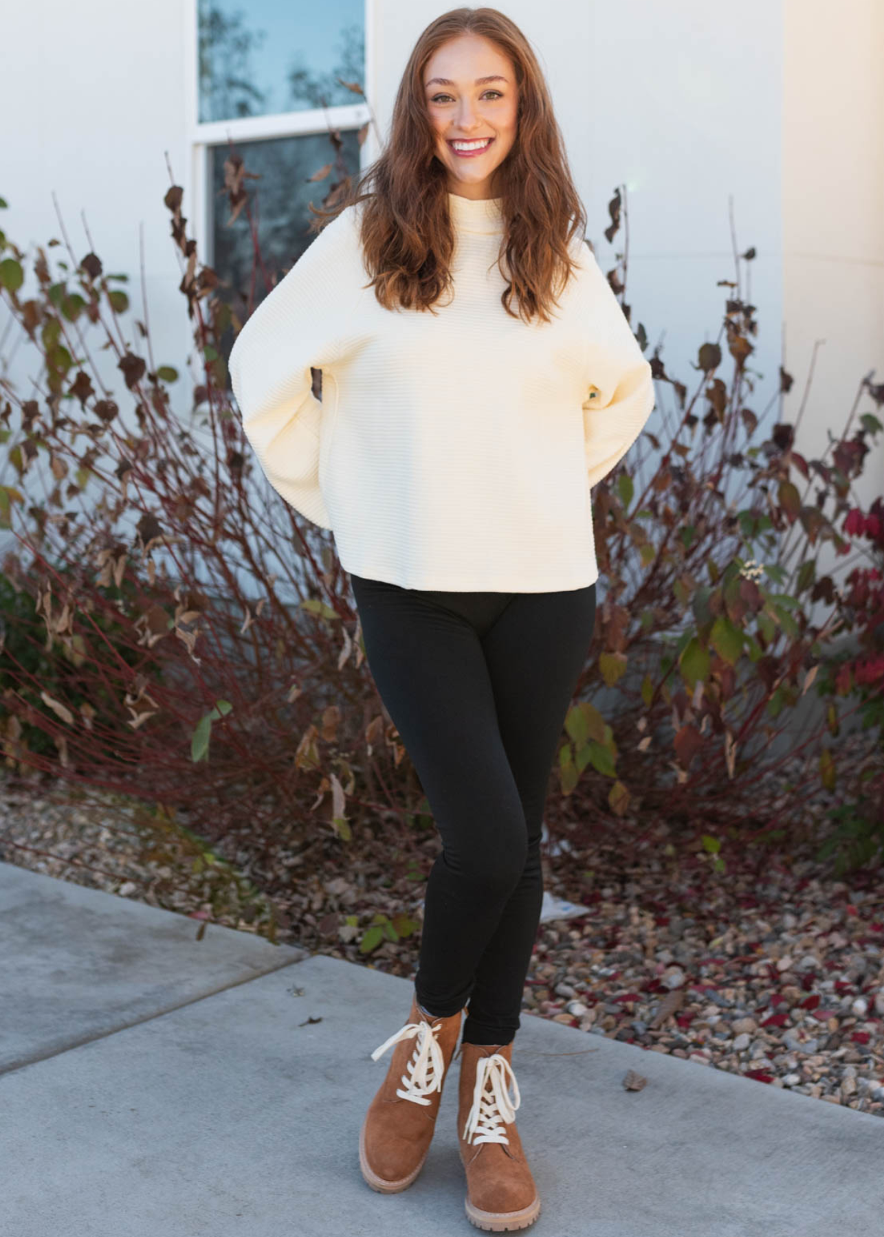 Long sleeve cream textured sweater with a mock turtle neck