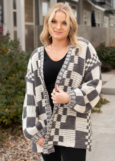 Front view of a long sleeve charcoal cardigan