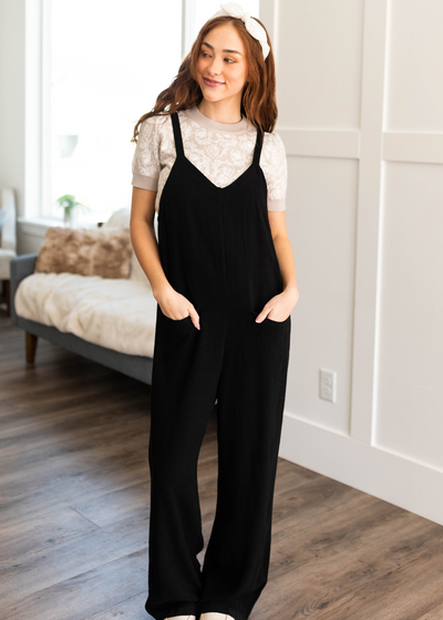 Front view of the black jumpsuit with pockets