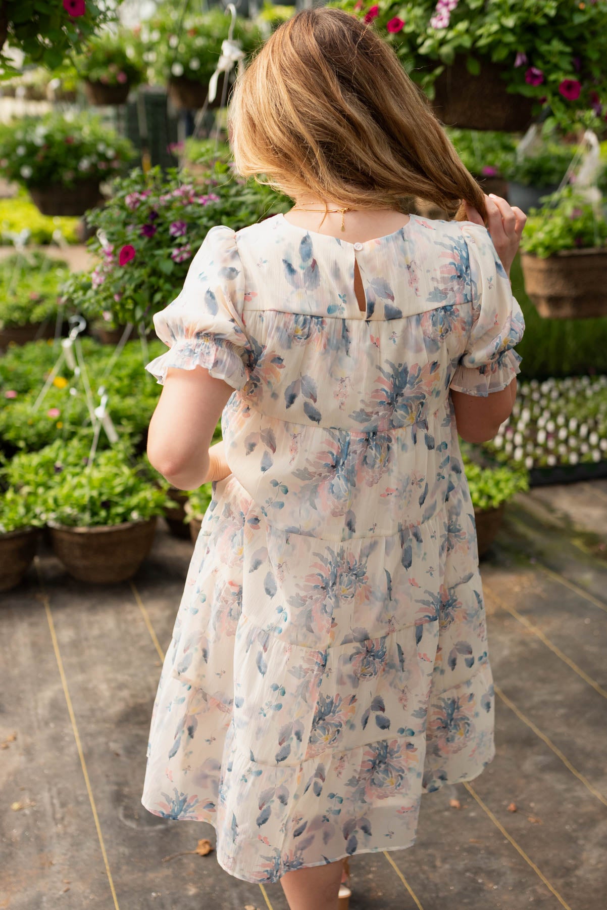 Back view of the blue floral puff sleeve dress