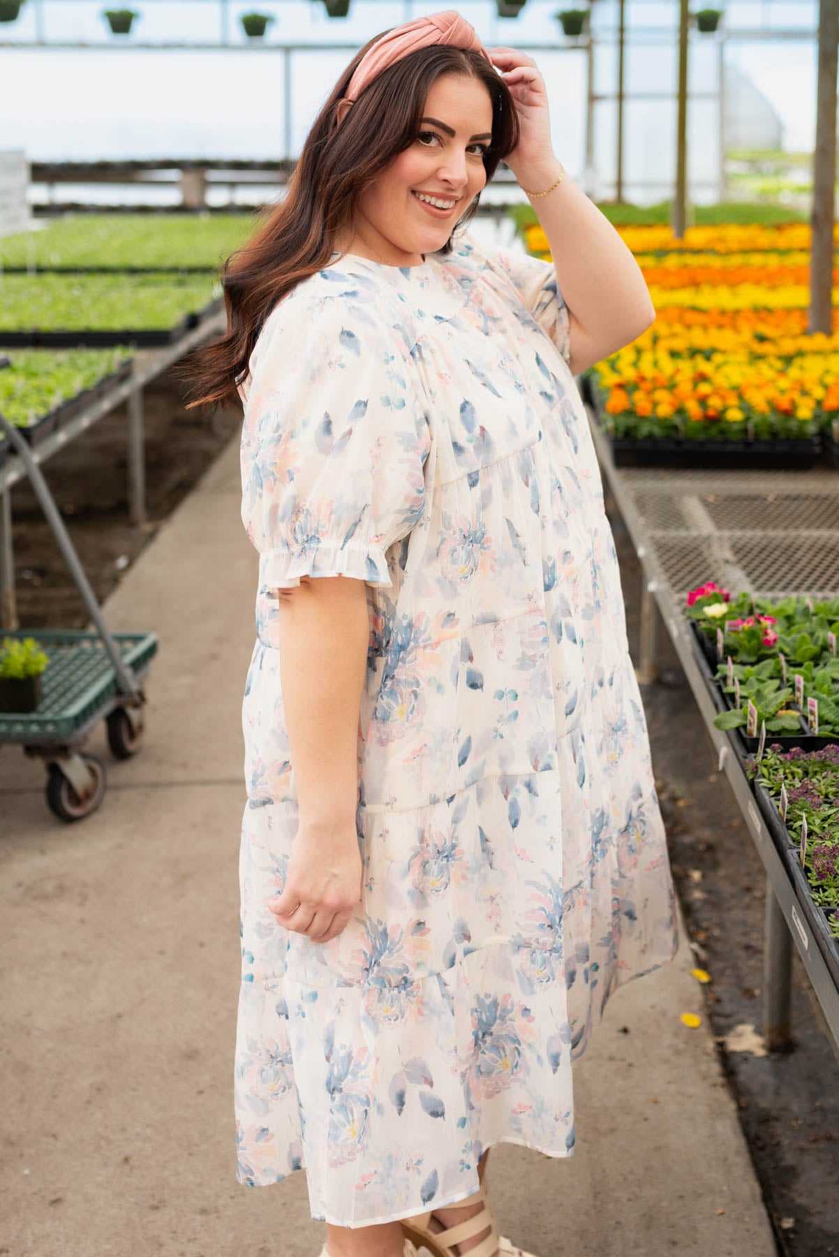 Side view of the blue floral puff sleeve dress in plus size