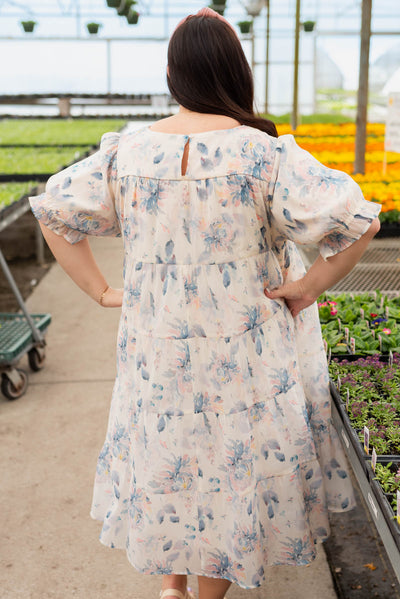 Back view of the plus size blue floral puff sleeve dress